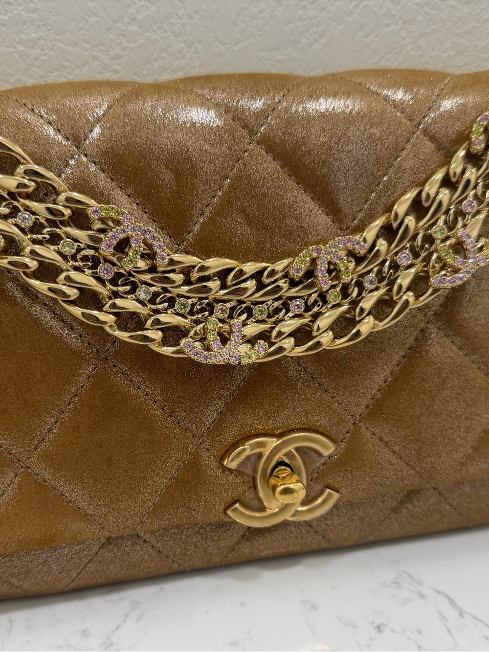 Chanel Iridescent Calfskin Quilted
Crystal Chain Flap Clutch Gold